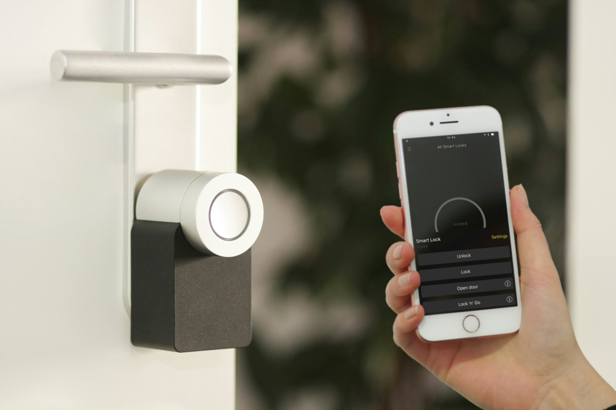 Smart door lock controlled via smartphone app on modern home door